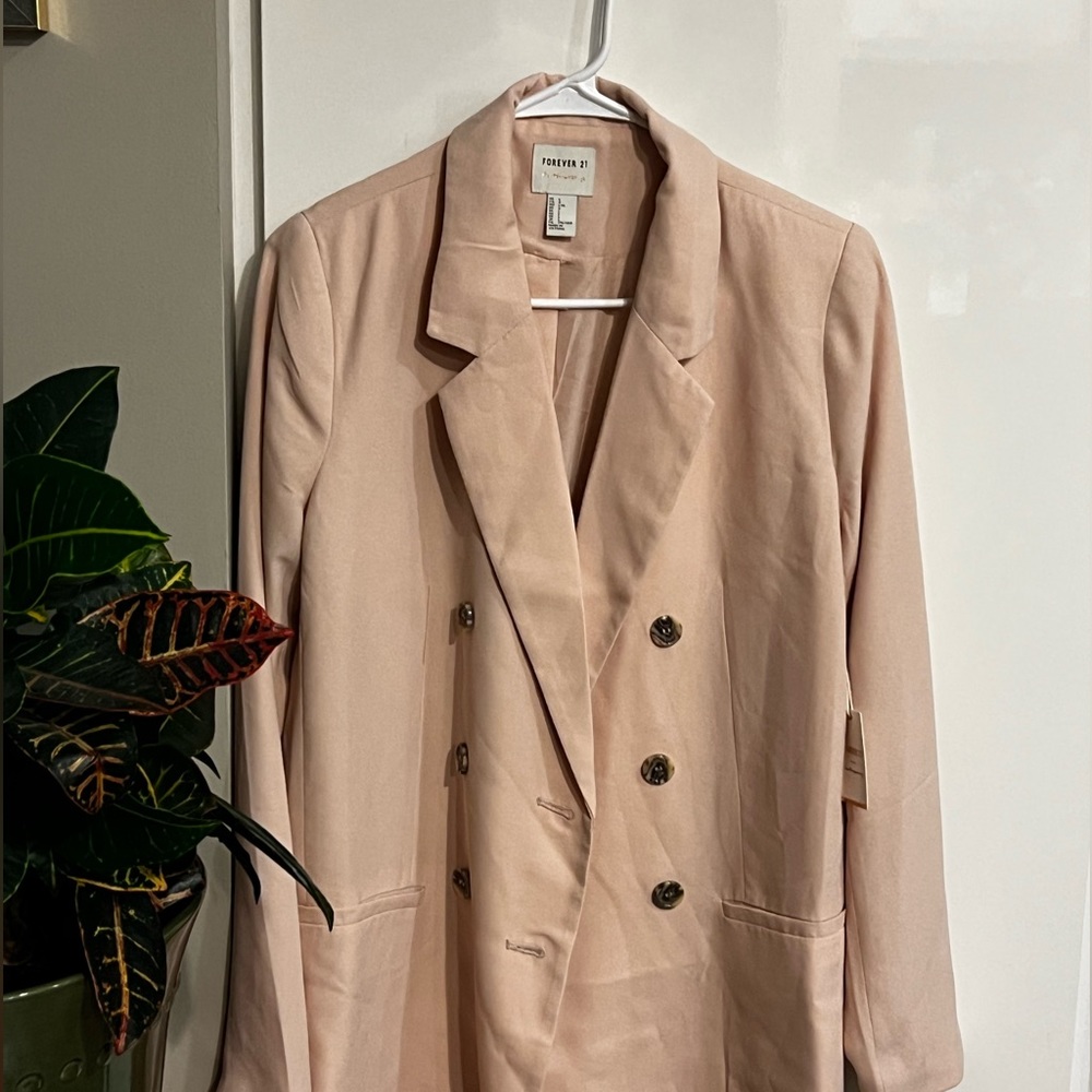 Never worn light pink blazer size large